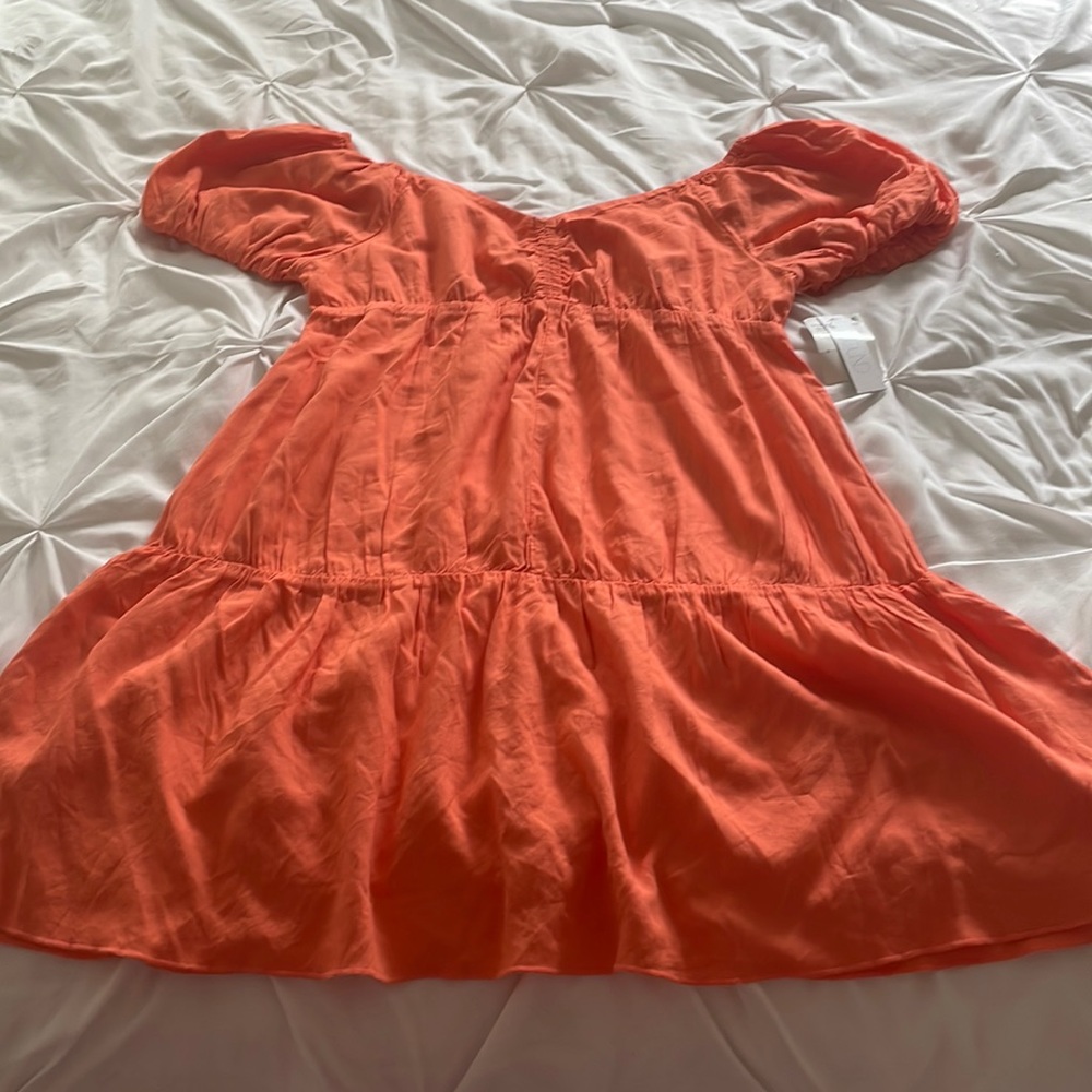 Pretty orange short flowy dress with scruchie short sleeves.
